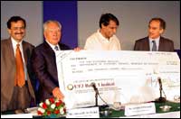 Osamu Suzuki, Chairman and CEO of Suzuki Motor Corporation with Maruti MD Jagdish Khattar (left), Heavy Industries Minister Suresh Prabhu (centre) and Divestment Minister Arun Shourie holding the cheque for Rs 10 billion which was presented to the government for the stake purchase in Maruti Udyog, in New Delhi on Thursday, May 30. Photograph: Bivas Banerjee