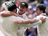 The Aussies celebrate the fall of a wicket